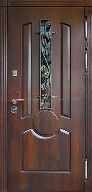Темная железная дверь со стеклом и ковкой для кирпичного дома ДСК-136 в Лобне