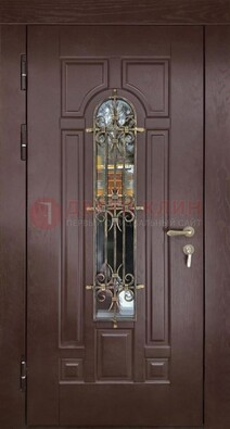 Темная железная дверь со стеклом и ковкой для частного дома ДСК-156 в Королеве