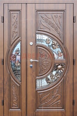 Уличная дверь в цвете Итальянский орех с виноритом и ковкой со стеклом ДВТ-147 в Краснознаменске
